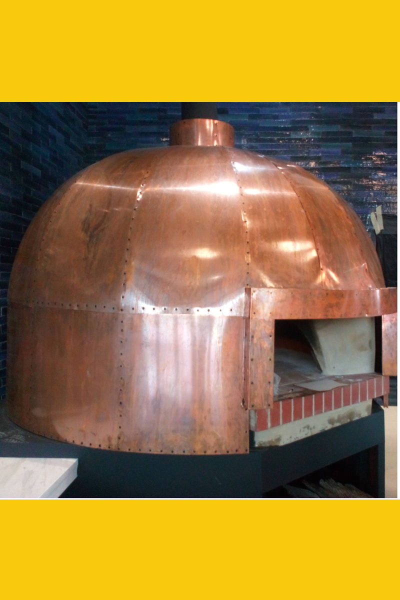Copper-clad pizza oven at Piza e Vino